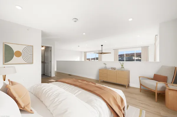 a bedroom with a bed and a couch