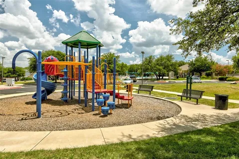 a view of a park with swings