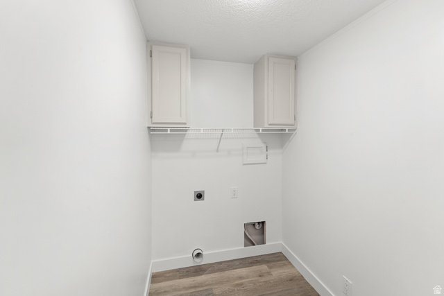 2600 North Hill Field Road, Unit 103A Layton, UT 84041 - Photo 24 of 31 Dedicated laundry space featuring wood-finish flooring and white walls