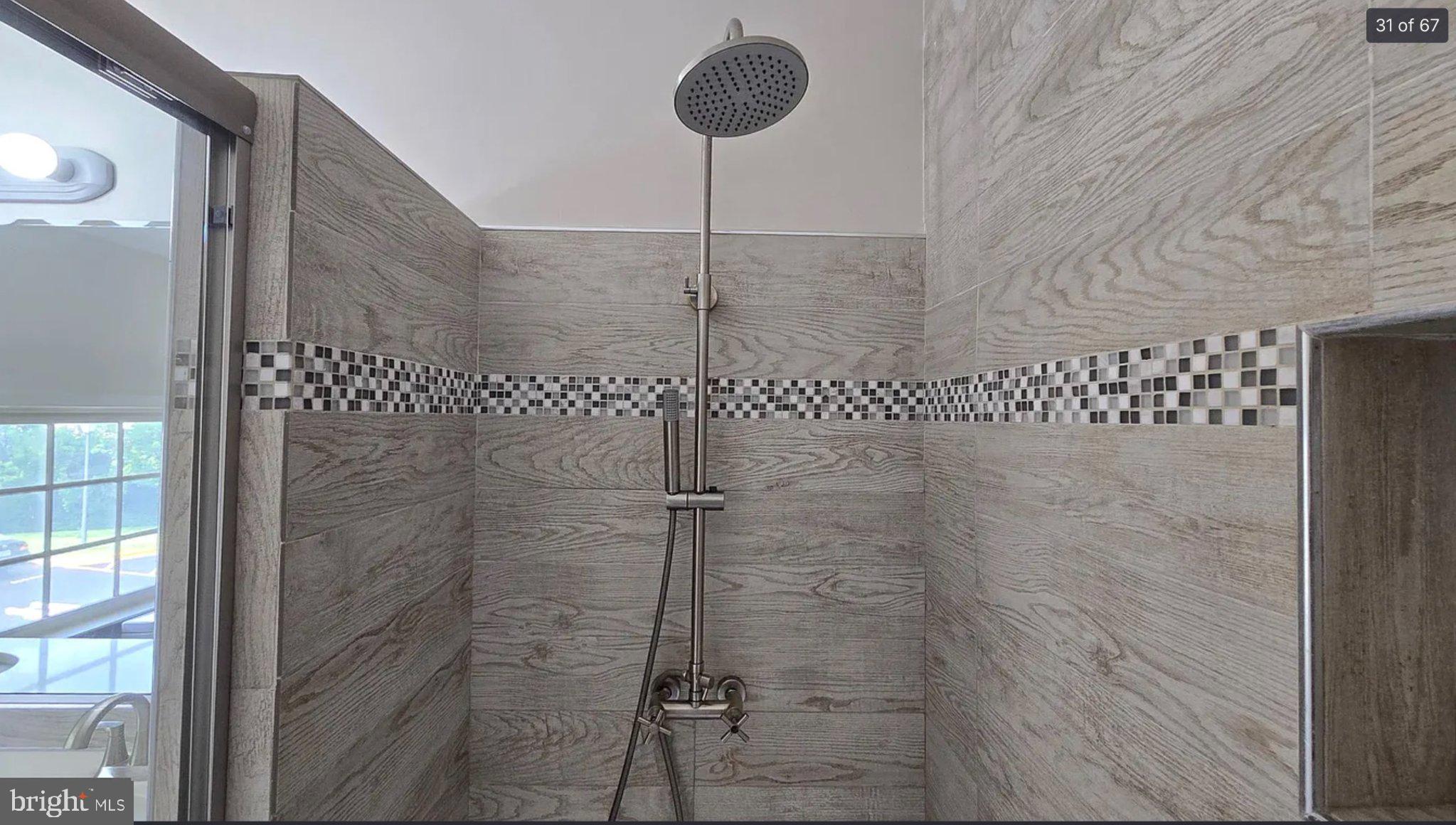 3906 Valley Ridge Drive Fairfax, VA 22033 - Photo 32 of 58 Sleek modern shower with elegant tiles.