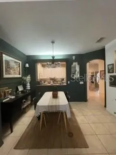 a kitchen with stainless steel appliances a refrigerator sink and cabinets