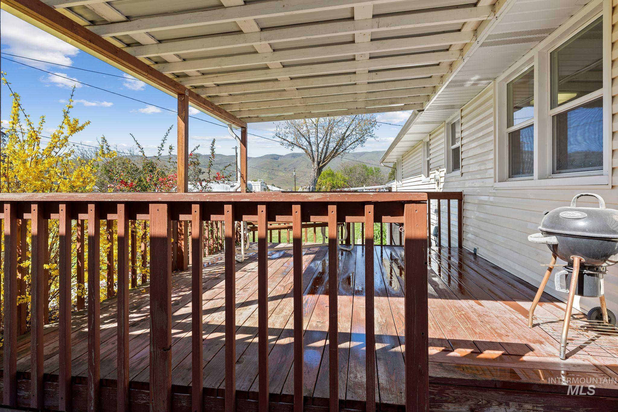 1148 Webster Street Clarkston, WA 99403 - Photo 26 of 29 Wooden deck with grilling area and a mountain view