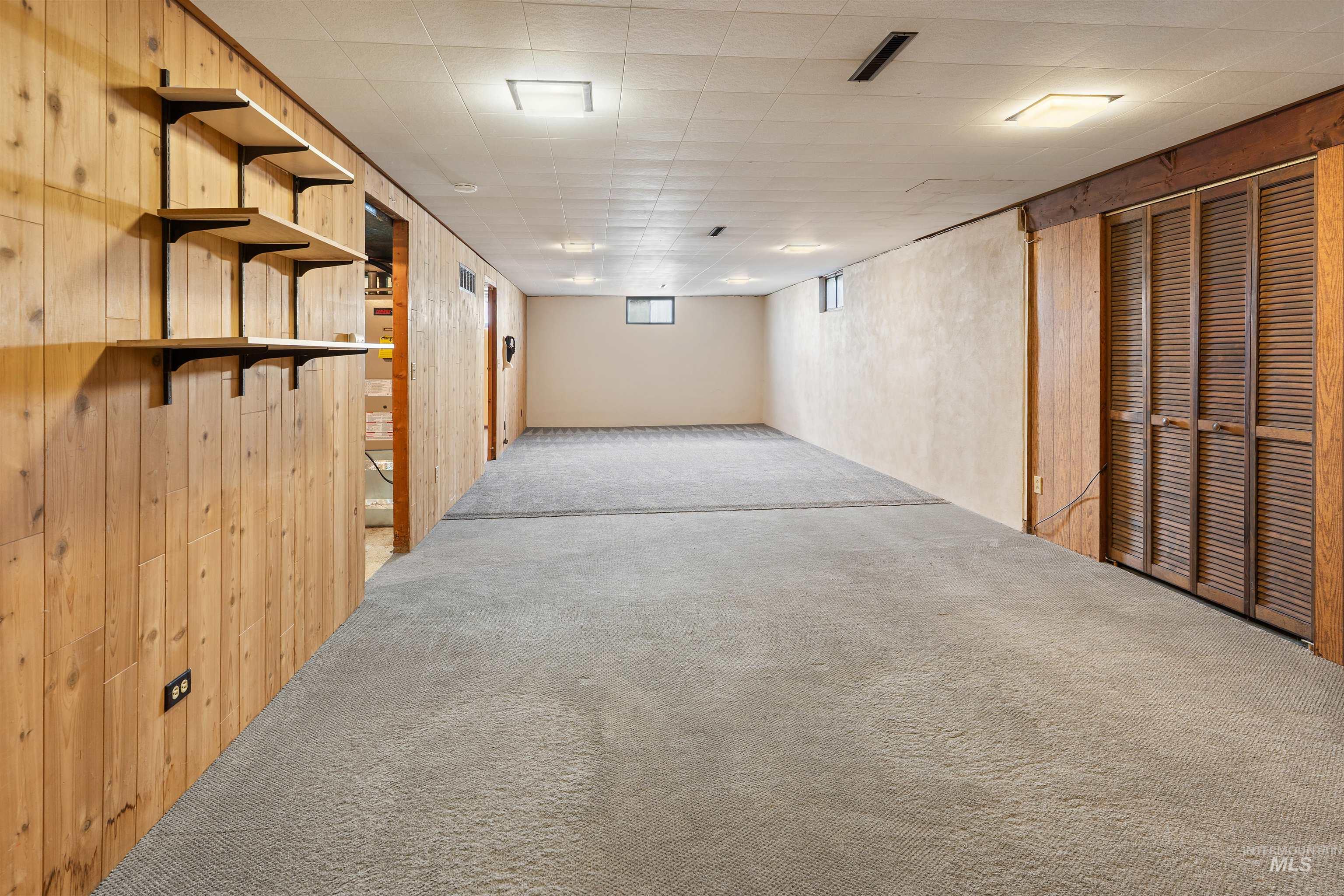 1148 Webster Street Clarkston, WA 99403 - Photo 10 of 29 Below grade area featuring light colored carpet and wooden walls