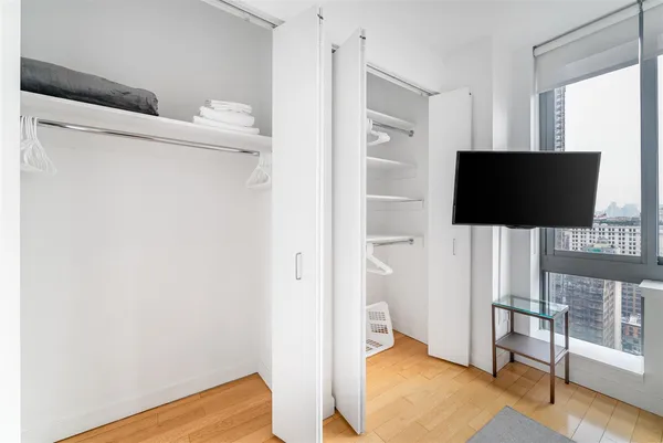 a view of a livingroom with wooden floor and chair
