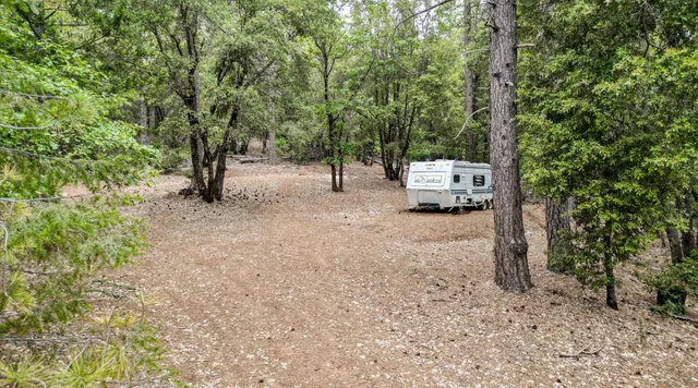 a view of a backyard of the house
