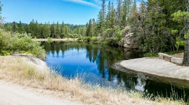 a view of a lake with a yard