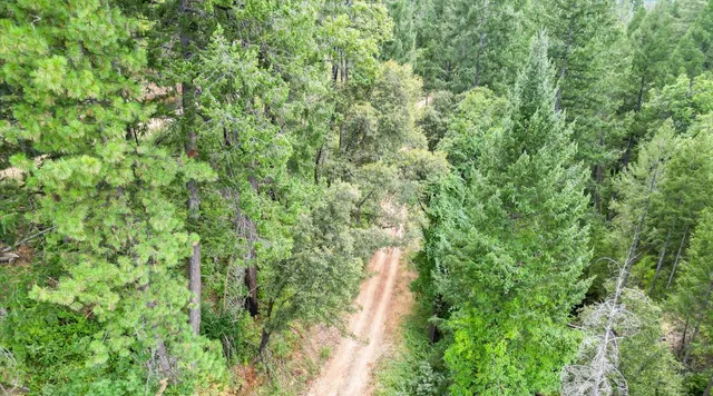 a view of a wooden deck and lake view