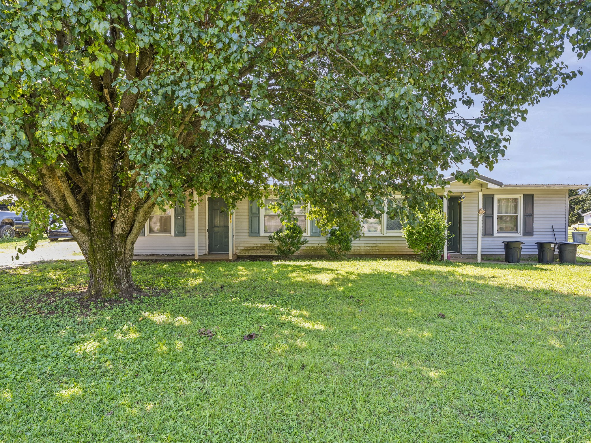1101 Cumberland Street Decherd, TN 37324 - Photo 1 of 9 a view of a house with a backyard