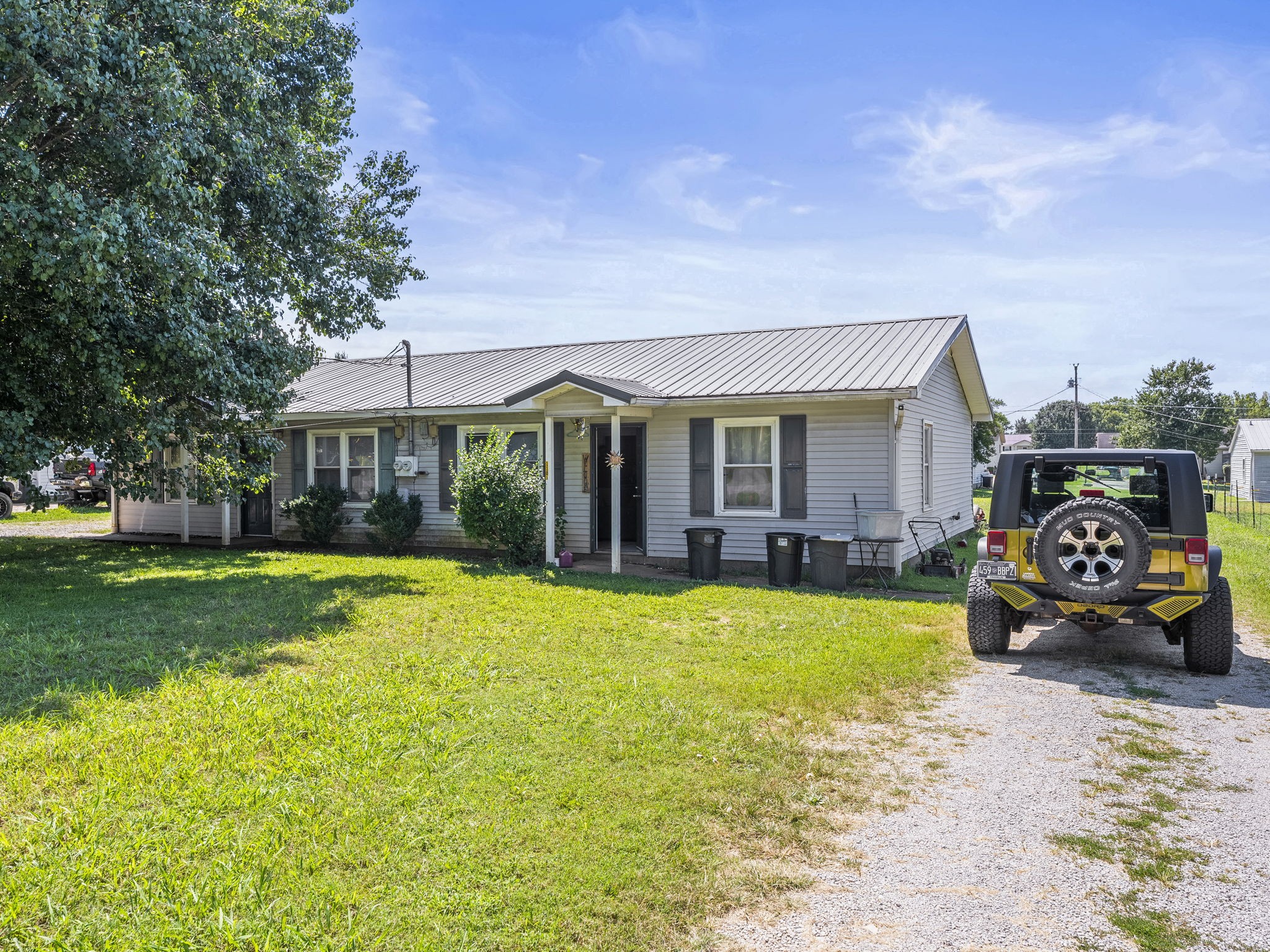 1101 Cumberland Street Decherd, TN 37324 - Photo 2 of 9 a front view of a house with swimming pool having outdoor seating