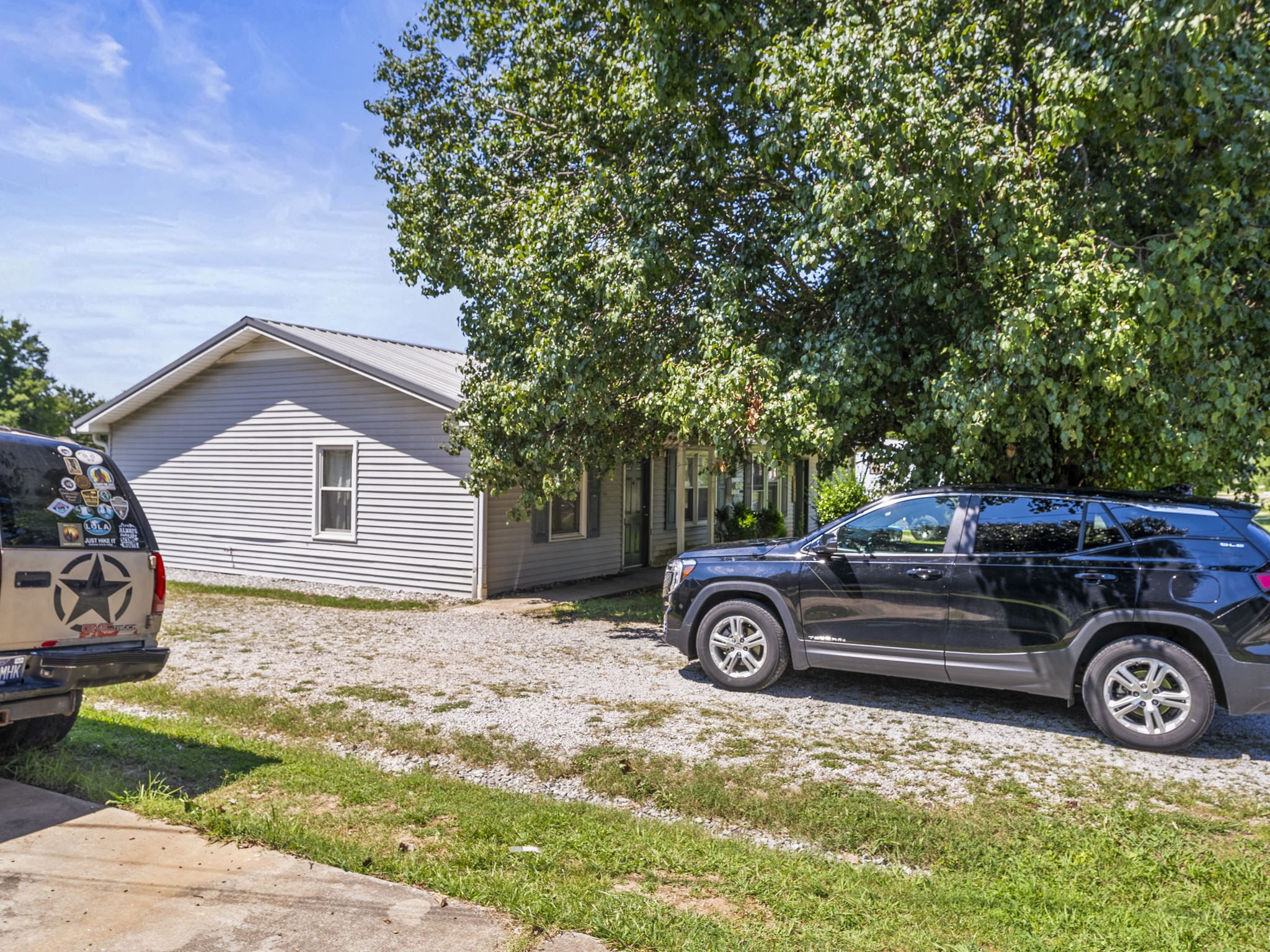 1101 Cumberland Street Decherd, TN 37324 - Photo 3 of 9 a car parked in front of a house