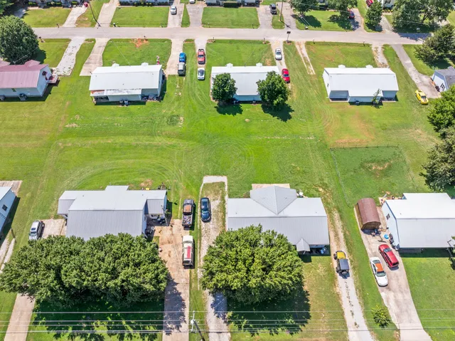 an aerial view of a house with outdoor space