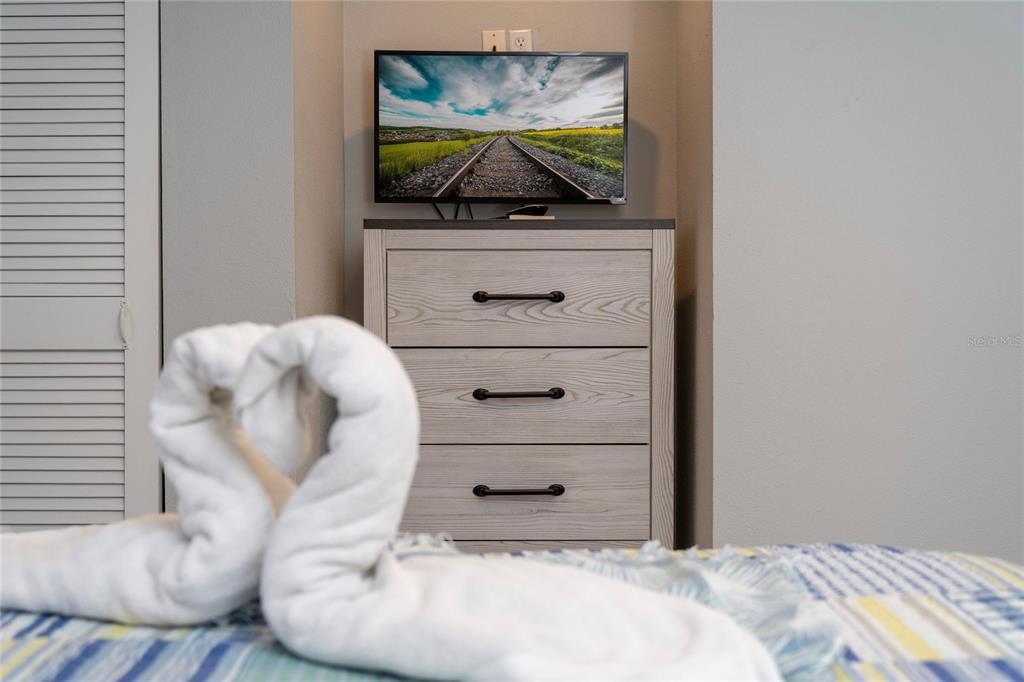 3100 Parkway Boulevard, Unit 511 Kissimmee, FL 34747 - Photo 19 of 40 a bed room with a bed and a television