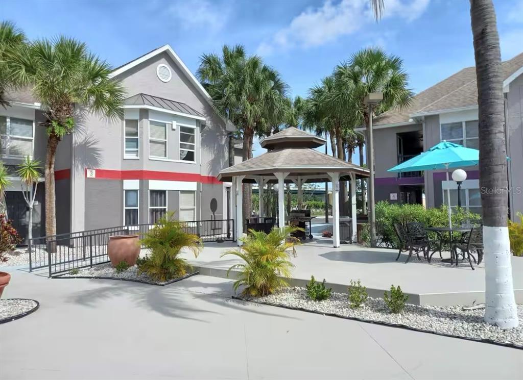 3100 Parkway Boulevard, Unit 511 Kissimmee, FL 34747 - Photo 2 of 40 a front view of a building with garden