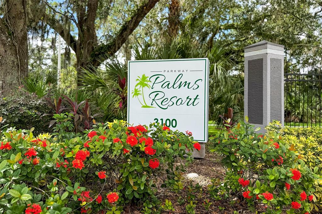 3100 Parkway Boulevard, Unit 511 Kissimmee, FL 34747 - Photo 24 of 40 a sign that is in front of flowers