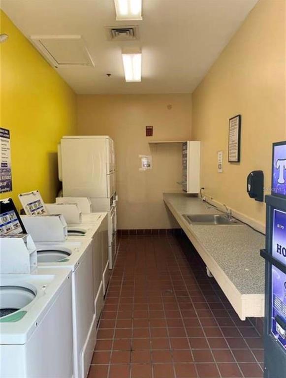 3100 Parkway Boulevard, Unit 511 Kissimmee, FL 34747 - Photo 25 of 40 a bed room with a bed and a night stand