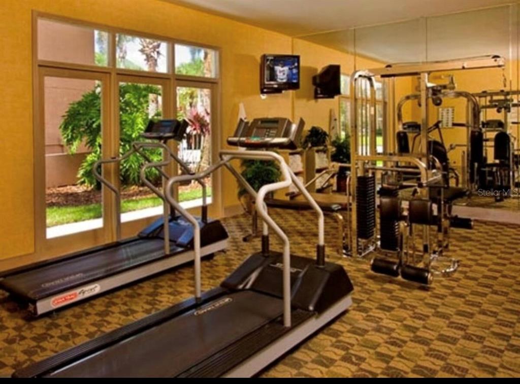 3100 Parkway Boulevard, Unit 511 Kissimmee, FL 34747 - Photo 26 of 40 a view of a room with gym equipment
