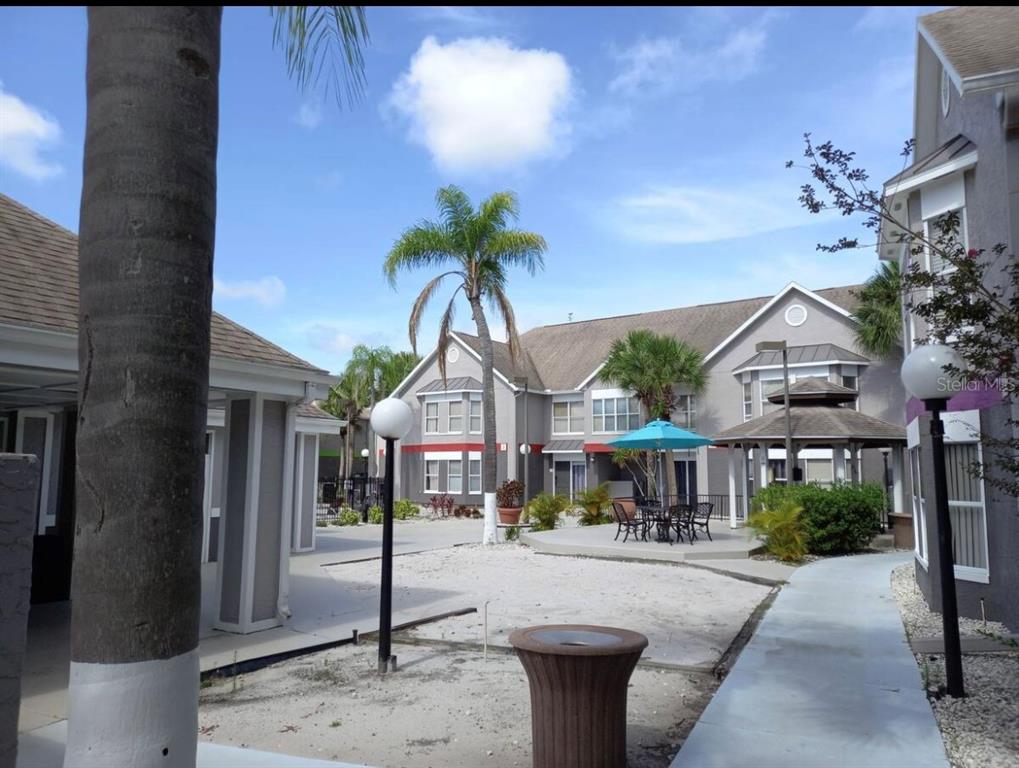 3100 Parkway Boulevard, Unit 511 Kissimmee, FL 34747 - Photo 30 of 40 a front view of a house with garden