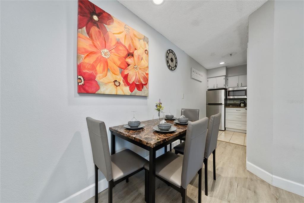 3100 Parkway Boulevard, Unit 511 Kissimmee, FL 34747 - Photo 7 of 40 a dining room with furniture and window