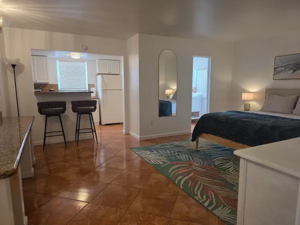 a bedroom with a bed and a table in it