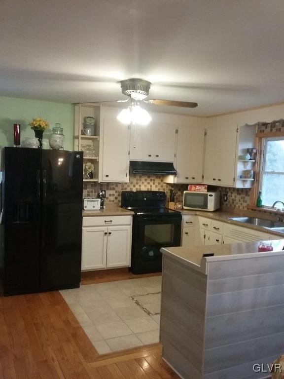 135 Longley Road Nazareth, PA 18064 - Photo 6 of 35 a kitchen with a stove top oven and cabinets