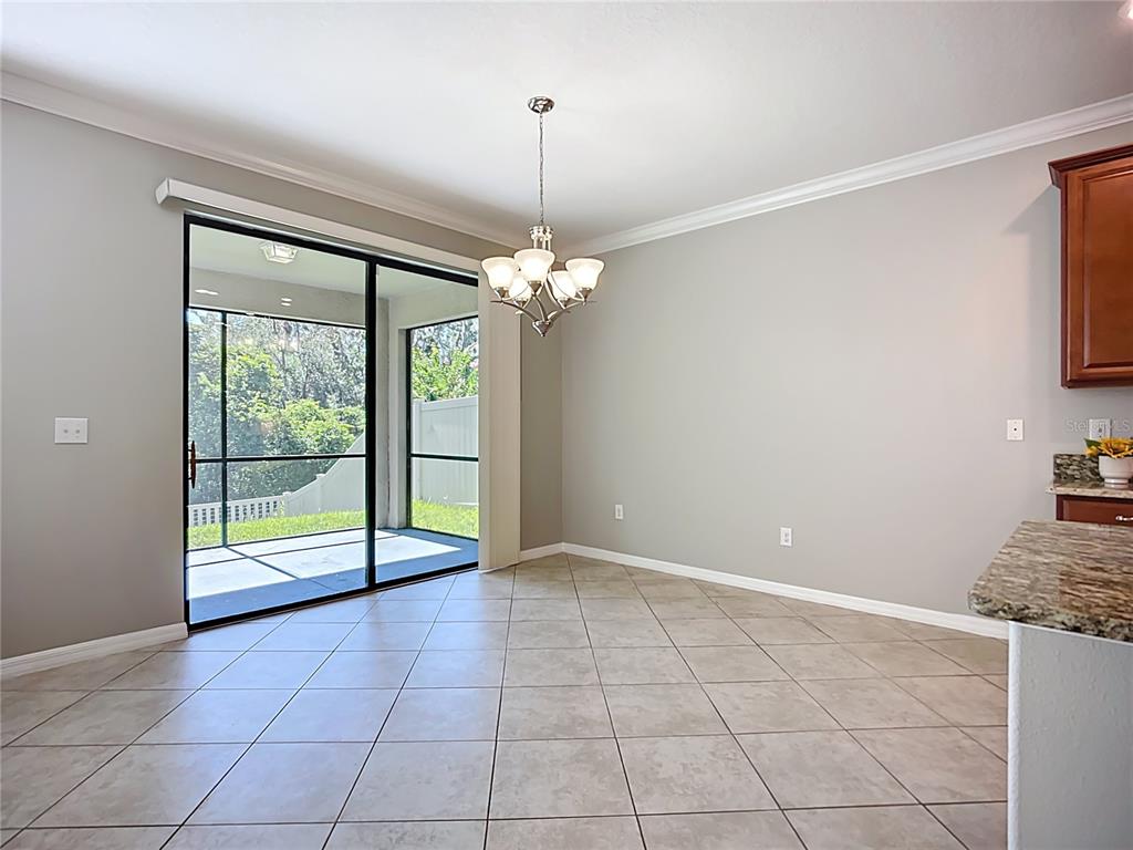 14240 Blue Dasher Drive Riverview, FL 33569 - Photo 29 of 66 a view of an empty room with glass door