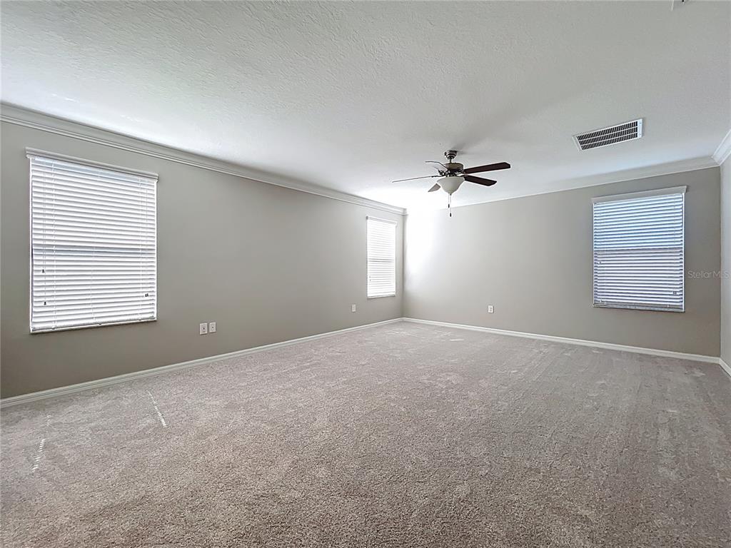 14240 Blue Dasher Drive Riverview, FL 33569 - Photo 41 of 66 a view of a livingroom with a ceiling fan and window