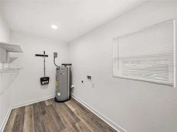a view of a storage & utility room with closet