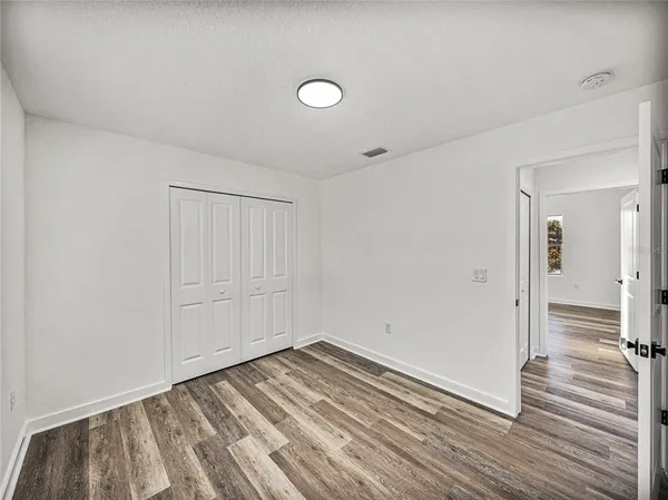 a view of a livingroom with wooden floor