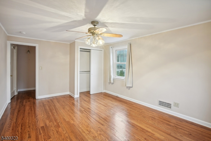49 Madison Avenue Summit, NJ 07901 - Photo 4 of 15 wooden floor in an empty room with a window