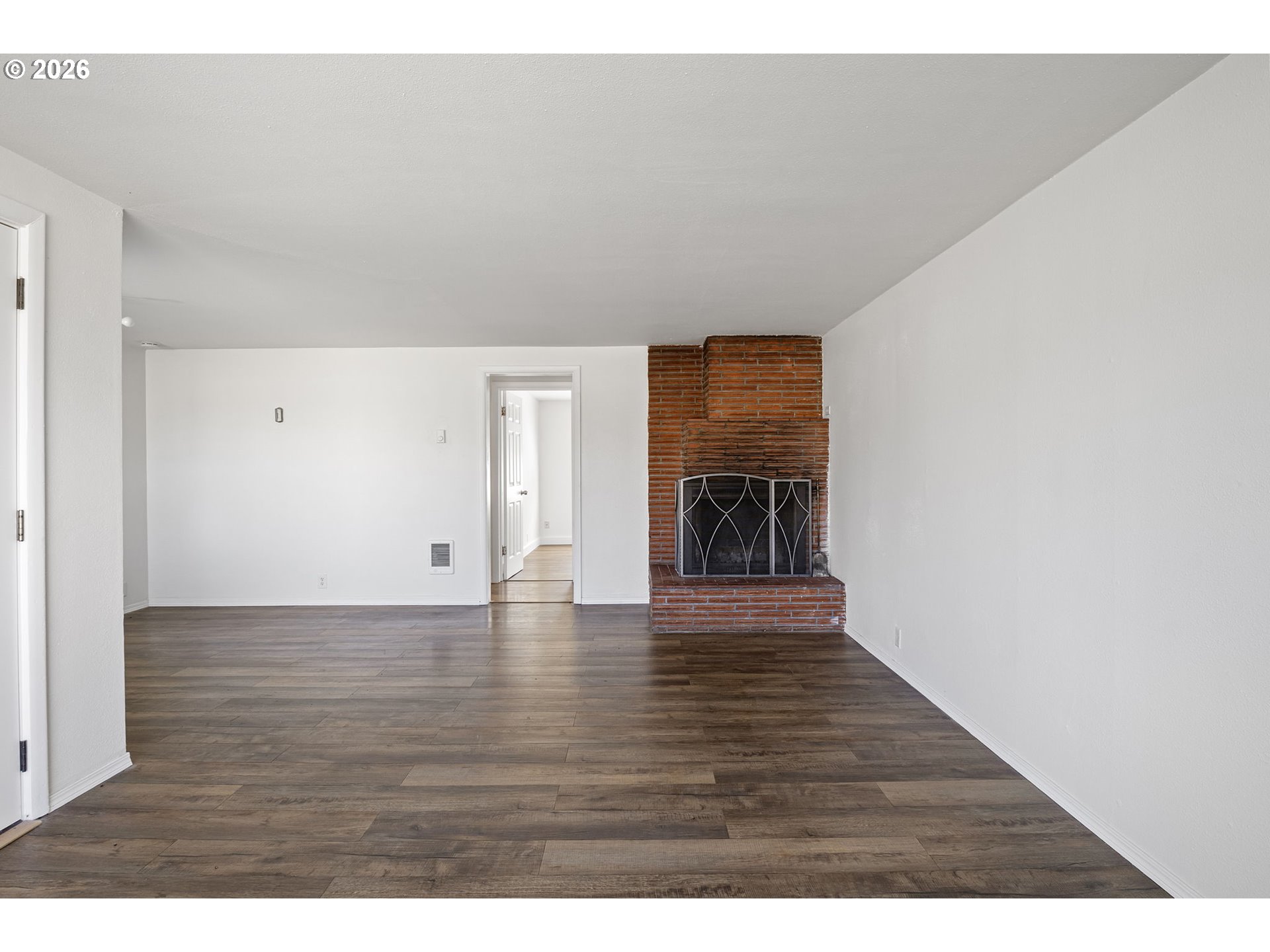 1008 Coburg Road Eugene, OR 97401 - Photo 5 of 46 a view of an empty room and wooden floor