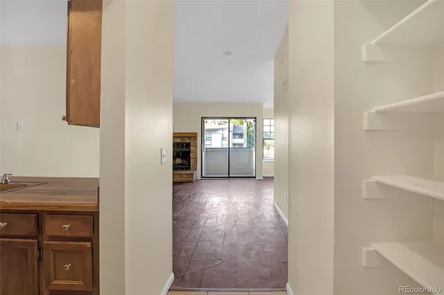 a kitchen with a sink and a refrigerator