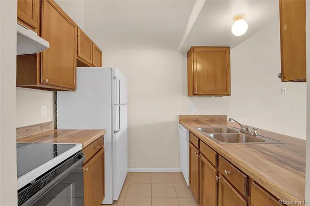 a kitchen with a sink and a microwave