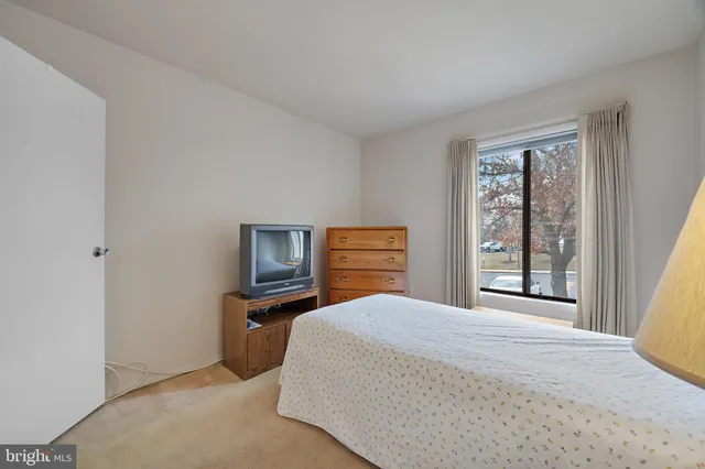 a bedroom with a bed and furniture