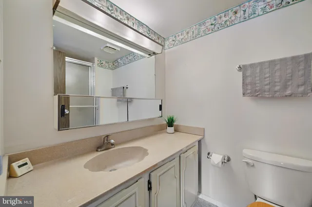 a bathroom with a shower and a toilet