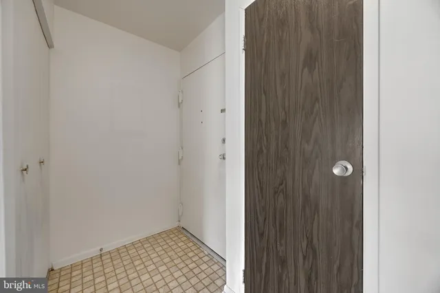 a view of a swimming pool with a chair and table in the patio