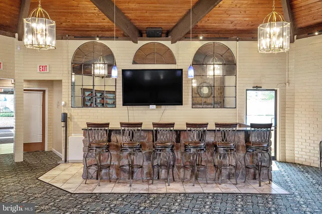 a view of a backyard with plants and a garden