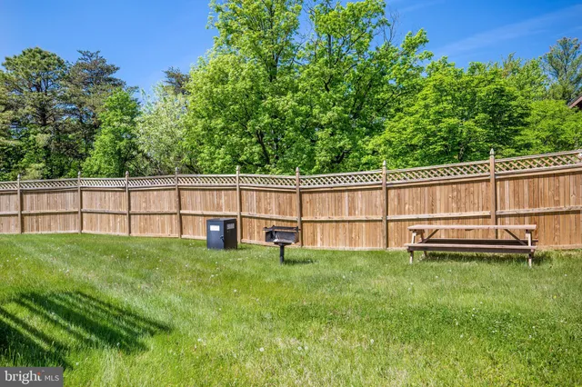 a view of a swimming pool with an outdoor seating