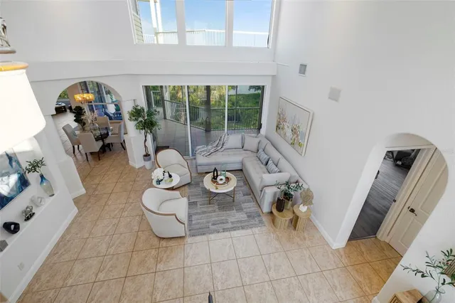 a spacious bedroom with a large bed and a large window