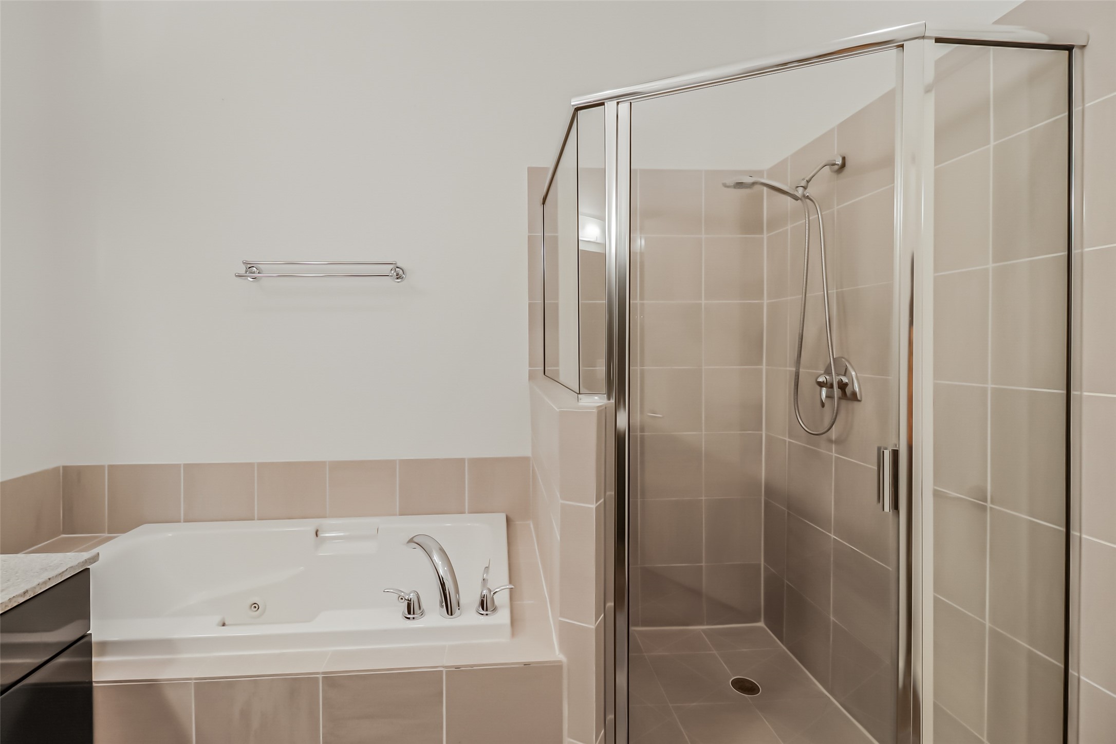 102 Quitman Street, Unit 301 Houston, TX 77009 - Photo 32 of 33 a bathroom with a bathtub and a shower