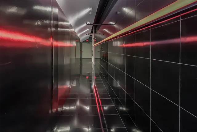 a view of a hallway with a large window