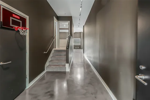 a bedroom with a bed and a mirror