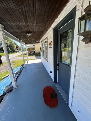 a view of a swimming pool with a porch
