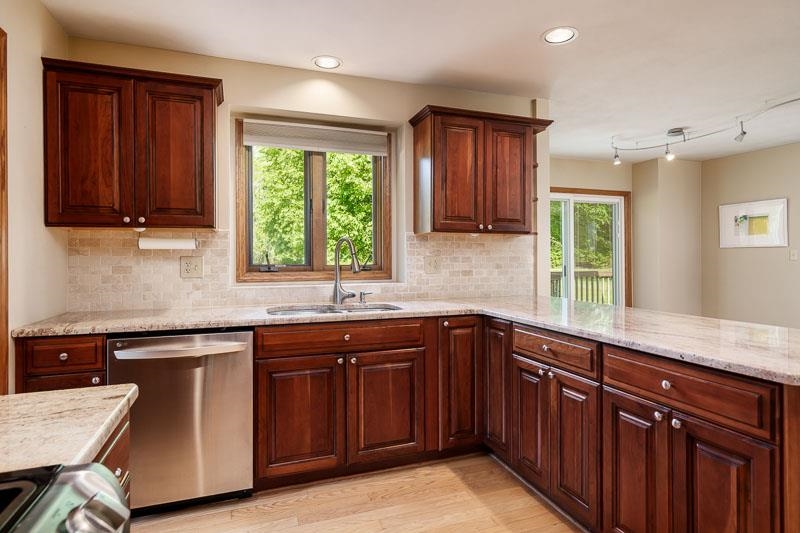 8833 West Ridge Drive Belvidere, IL 61008 - Photo 37 of 65 a kitchen with a sink stove and cabinets
