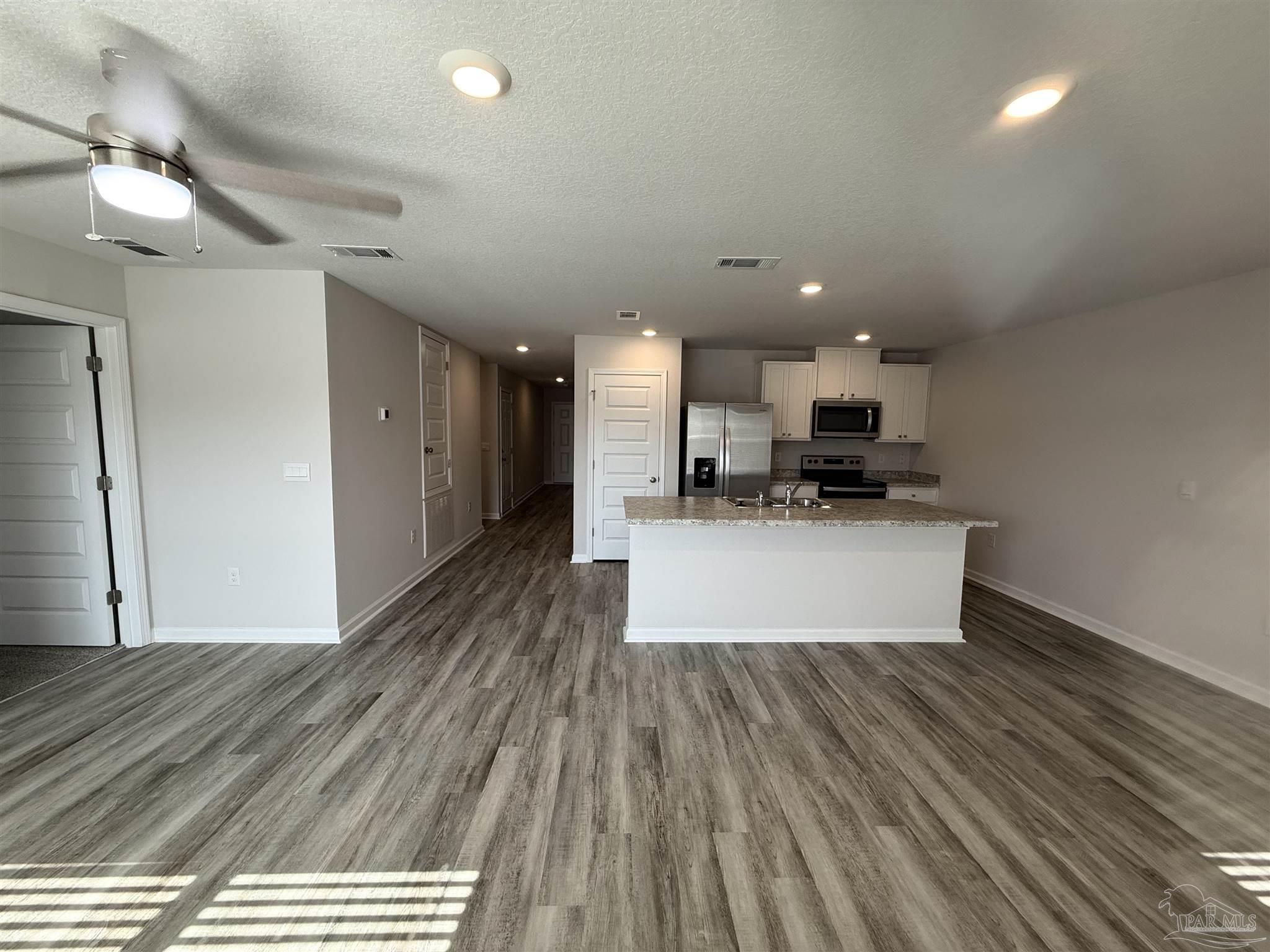 4335 Redbay Court Pace, FL 32571 - Photo 14 of 30 a view of kitchen with sink microwave and stove