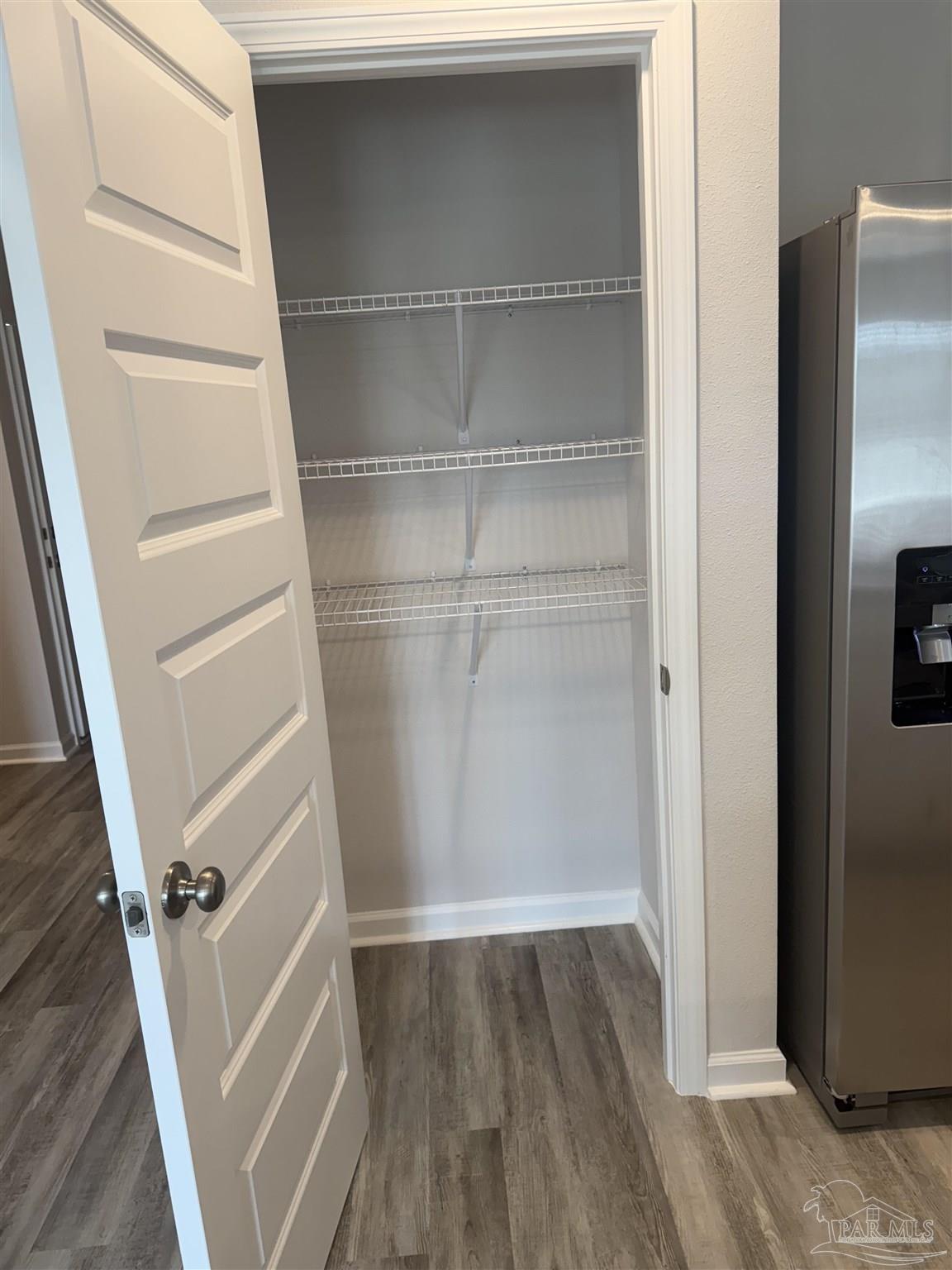 4335 Redbay Court Pace, FL 32571 - Photo 15 of 30 a view of walk in closet with empty racks