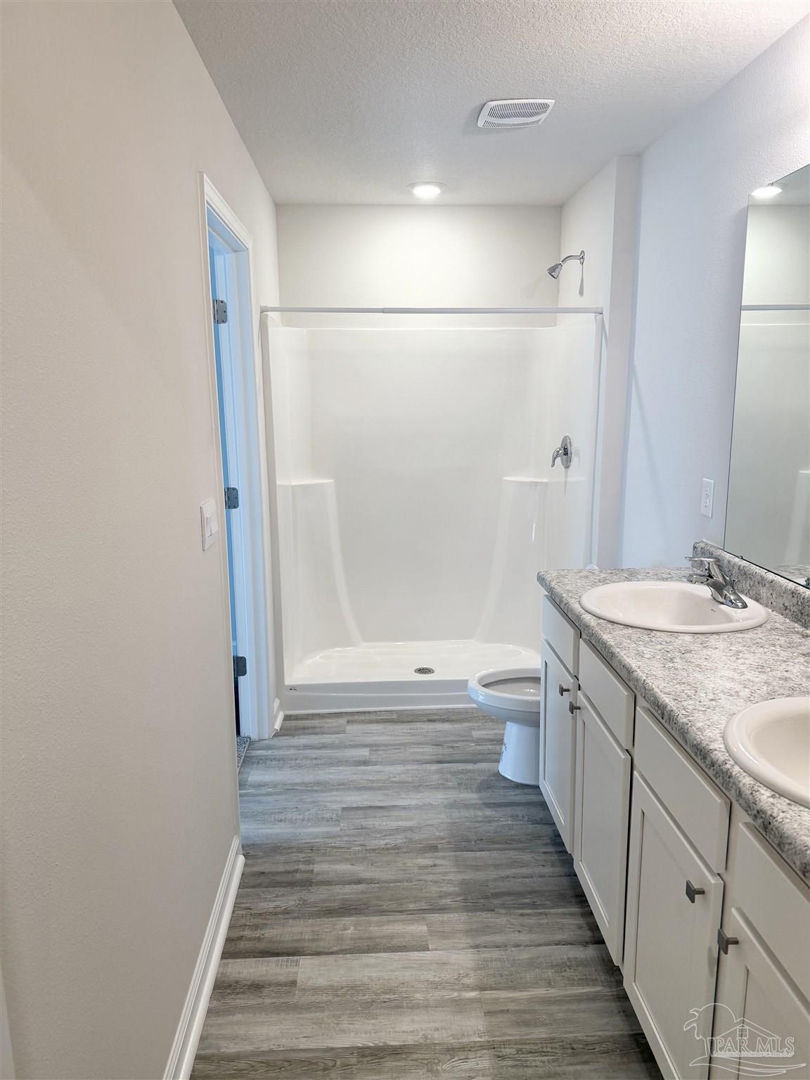 4335 Redbay Court Pace, FL 32571 - Photo 18 of 30 a bathroom with a sink a toilet and shower