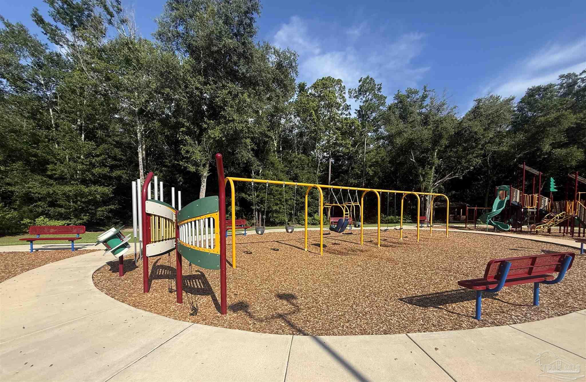 4335 Redbay Court Pace, FL 32571 - Photo 27 of 30 a view of a park with swings