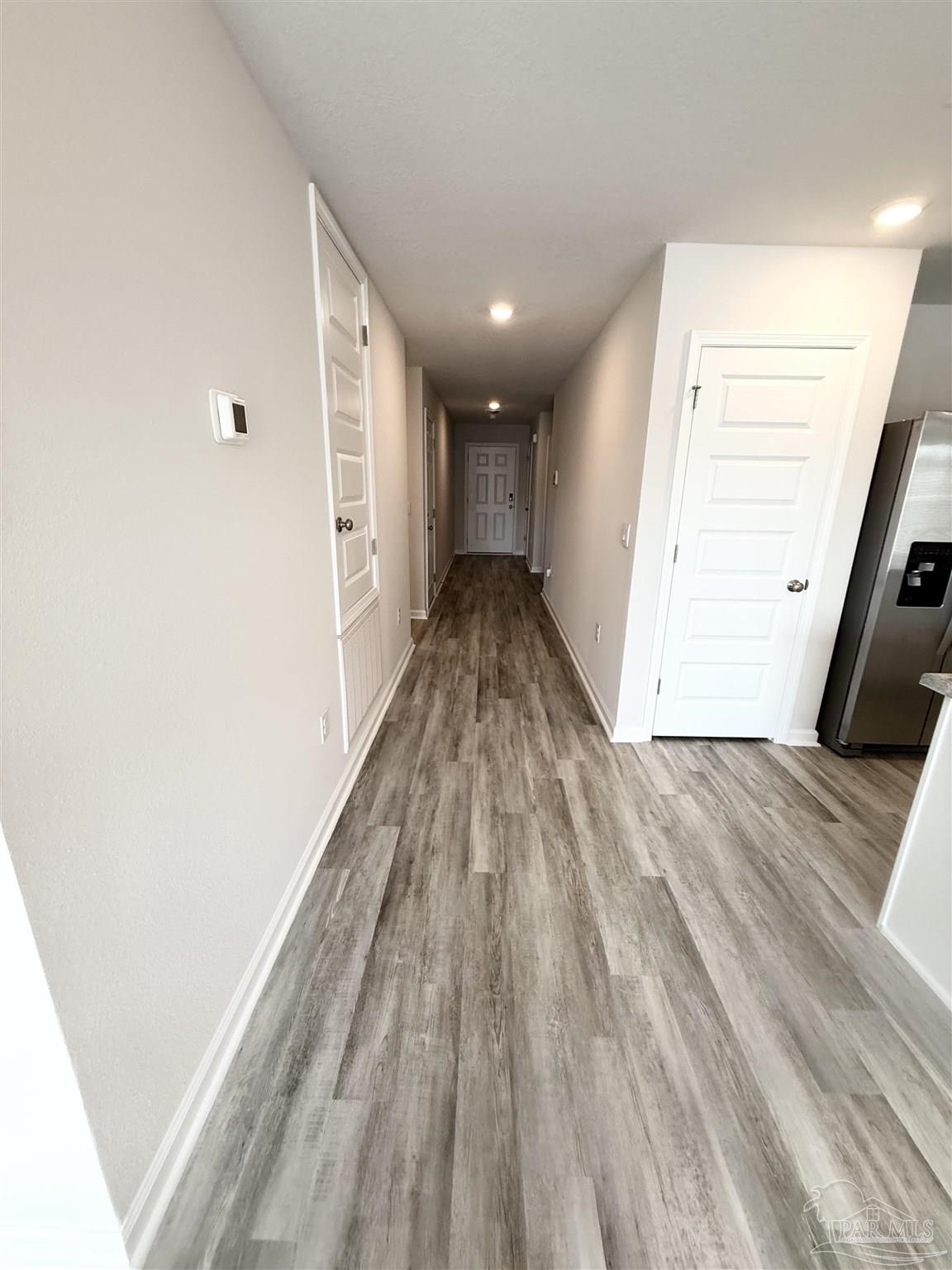 4335 Redbay Court Pace, FL 32571 - Photo 3 of 30 a view of hallway with wooden floor
