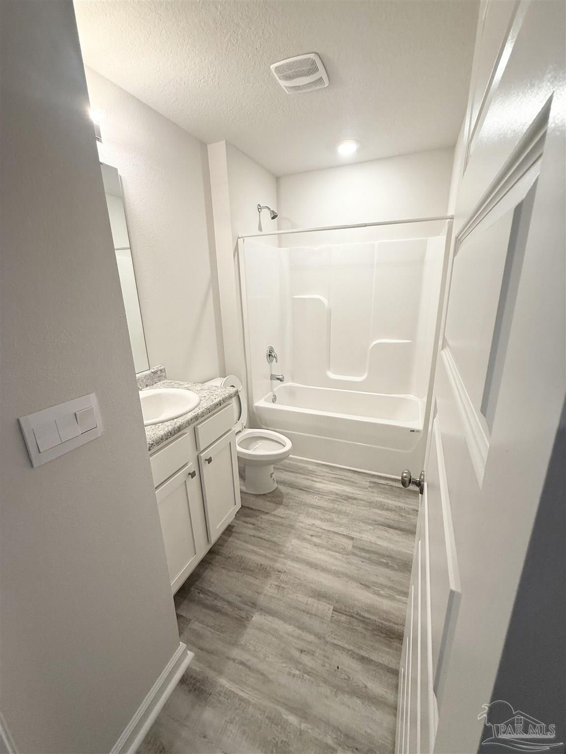 4335 Redbay Court Pace, FL 32571 - Photo 7 of 30 a bathroom with a sink a toilet and a shower