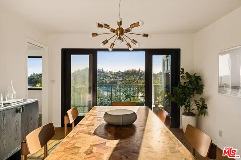 a balcony view with a glass door